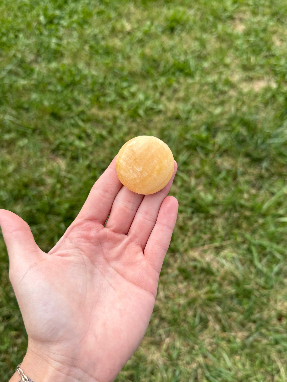 Small orange calcite round flats