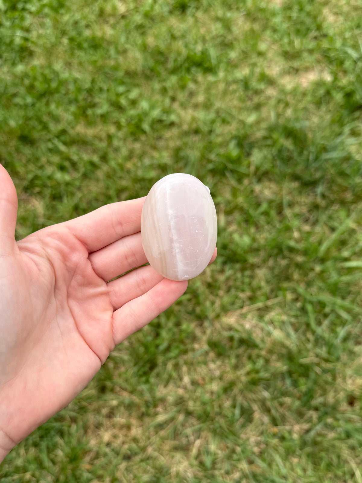 Medium pink banded onyx palm stones