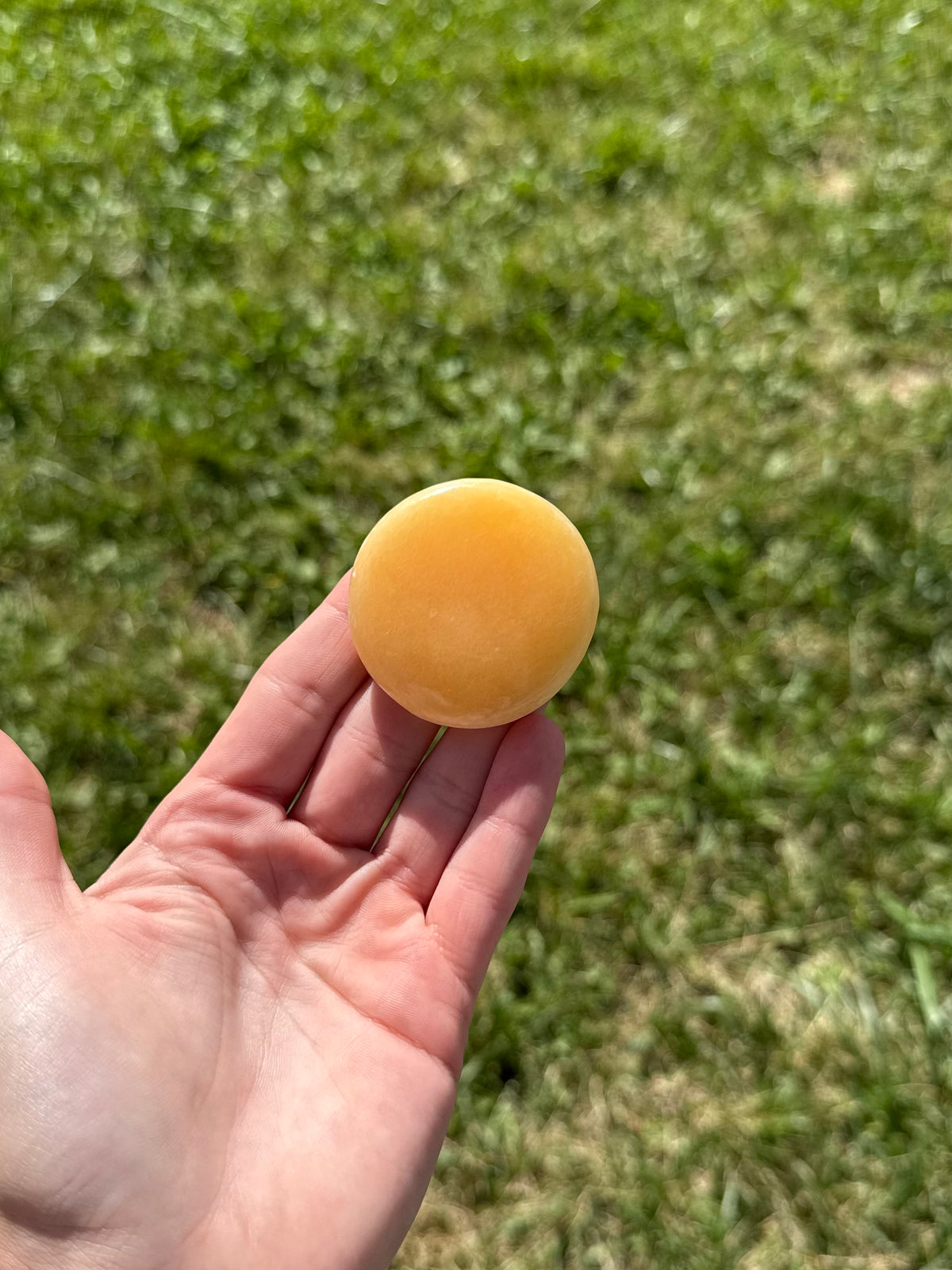 Large orange calcite round flats
