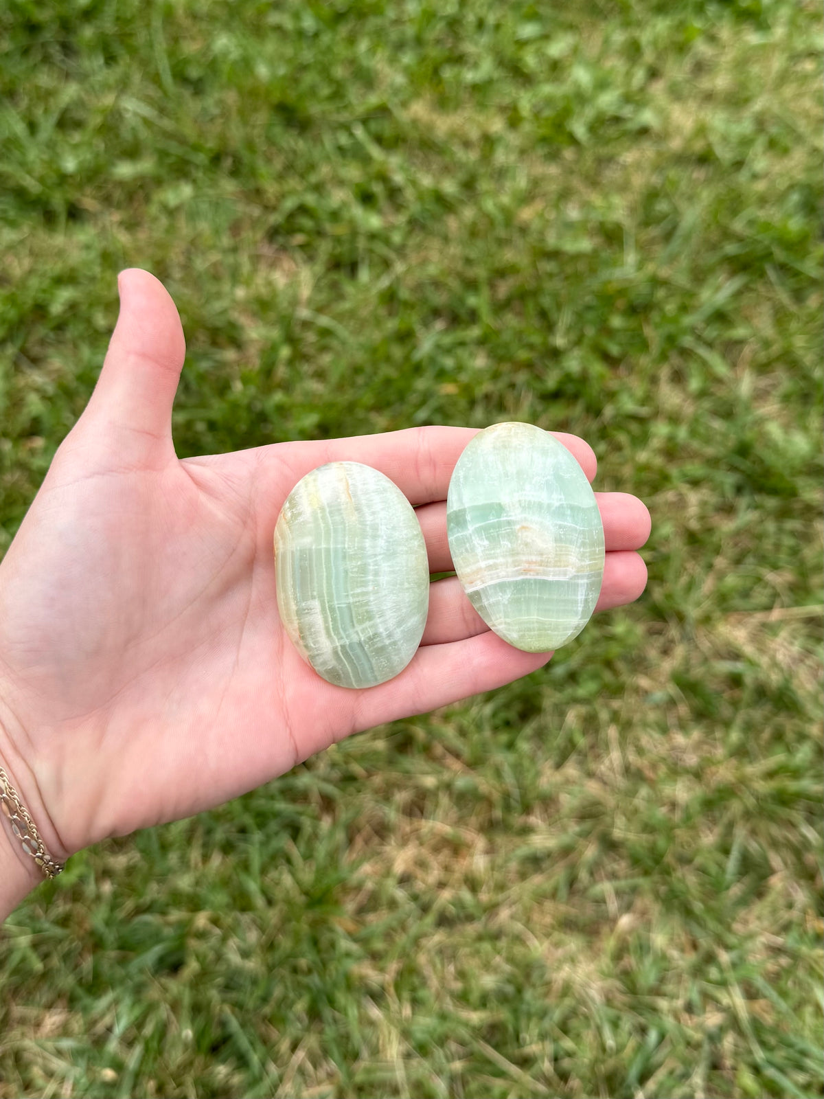 Medium pistachio calcite palm stones