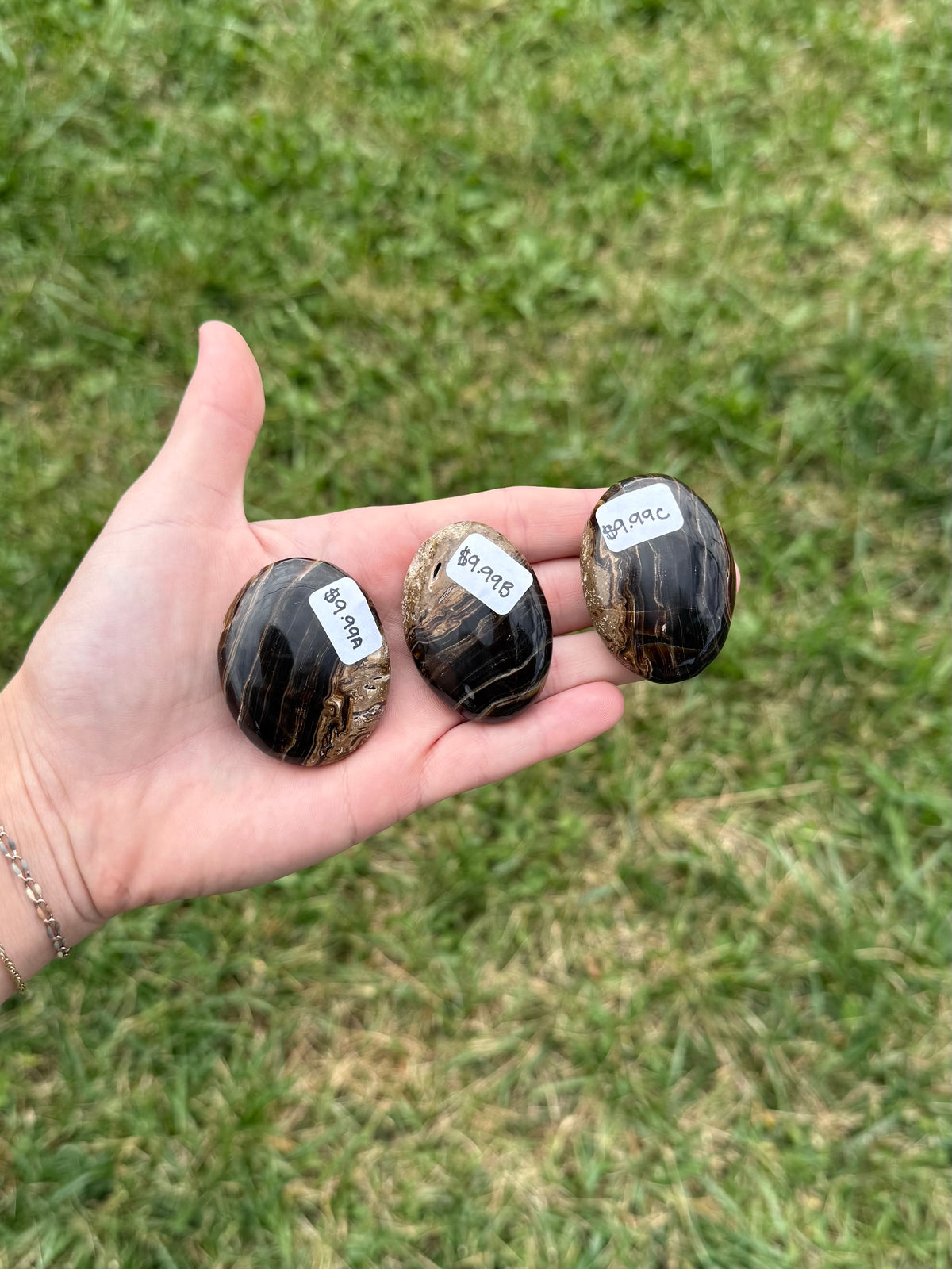 Small chocolate calcite palm stones