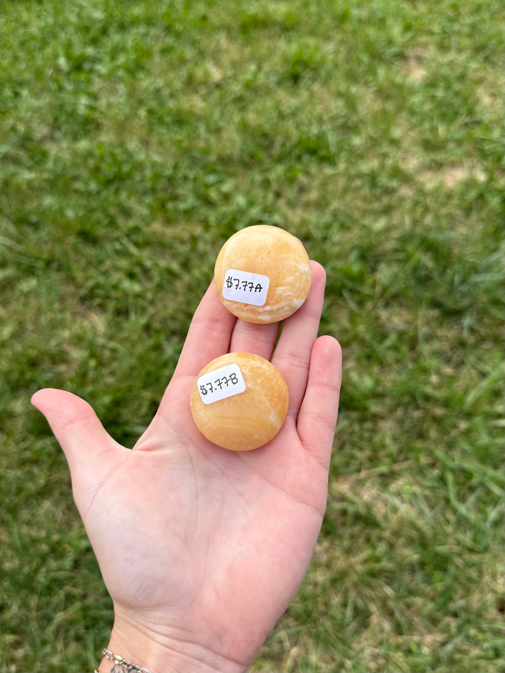 Small orange calcite round flats