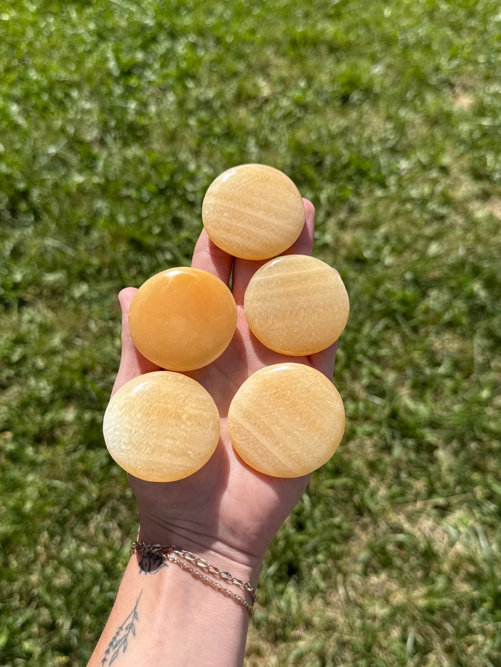 Large orange calcite round flats