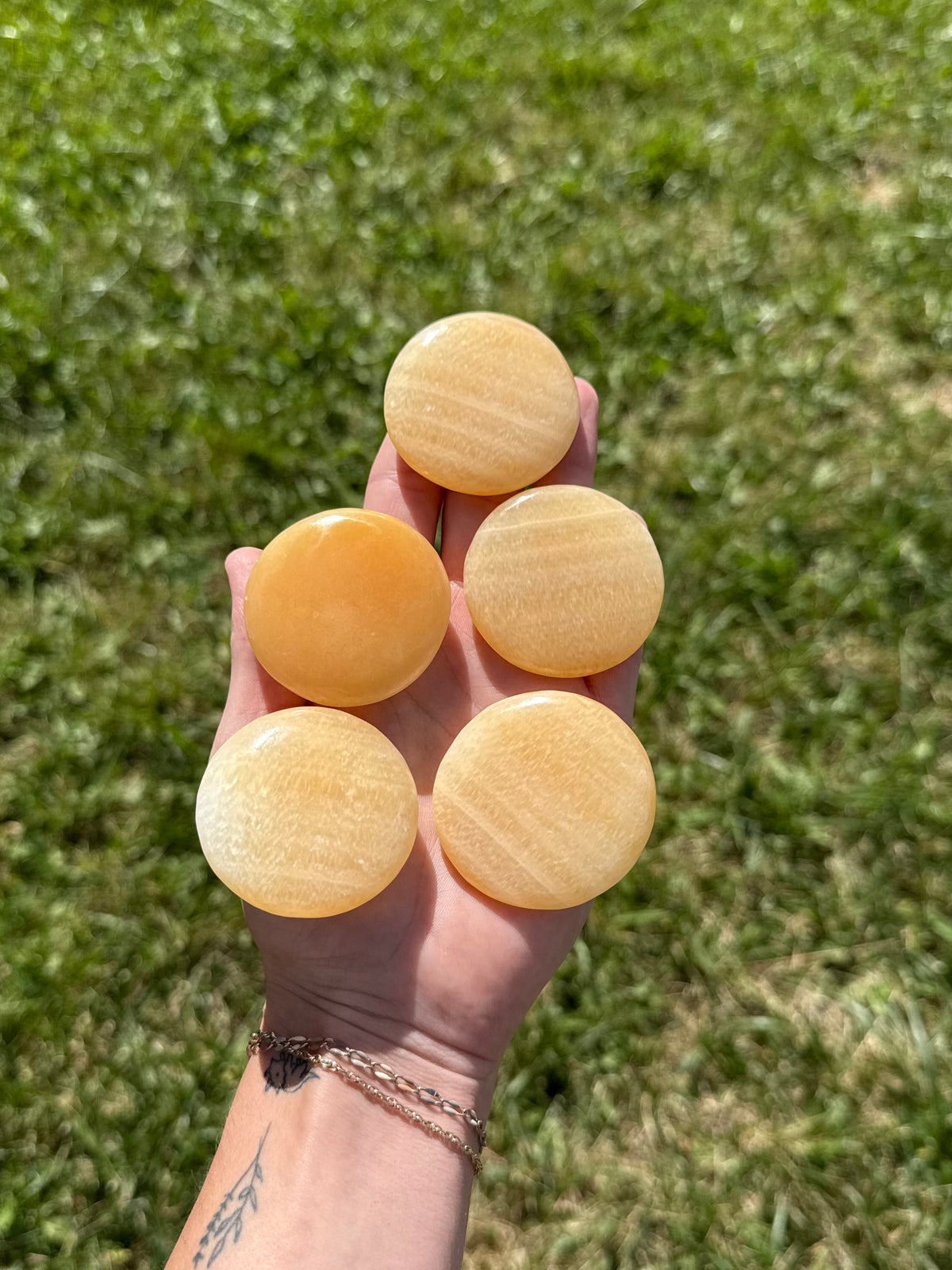 Large orange calcite round flats