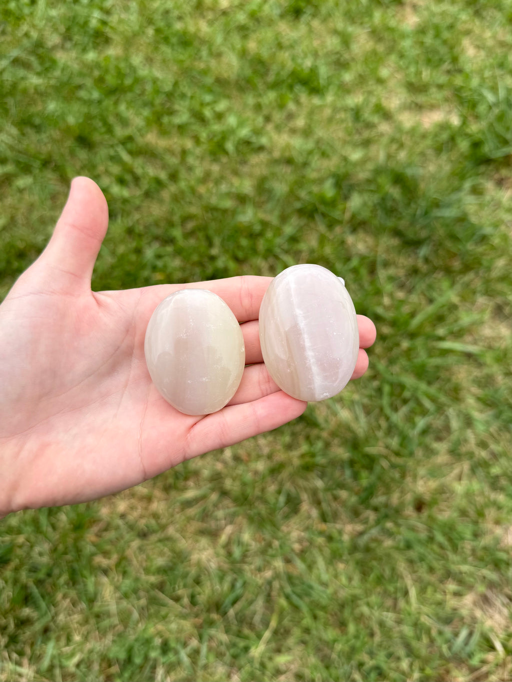 Medium pink banded onyx palm stones