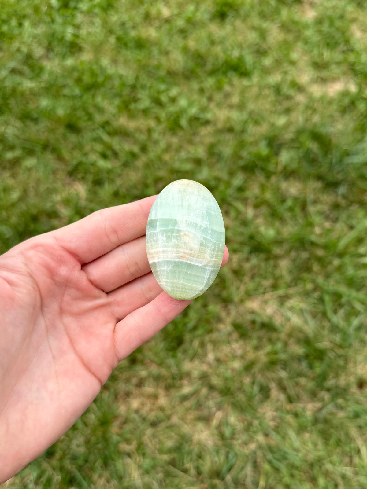 Medium pistachio calcite palm stones