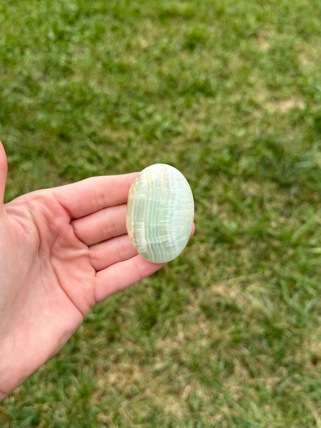 Medium pistachio calcite palm stones