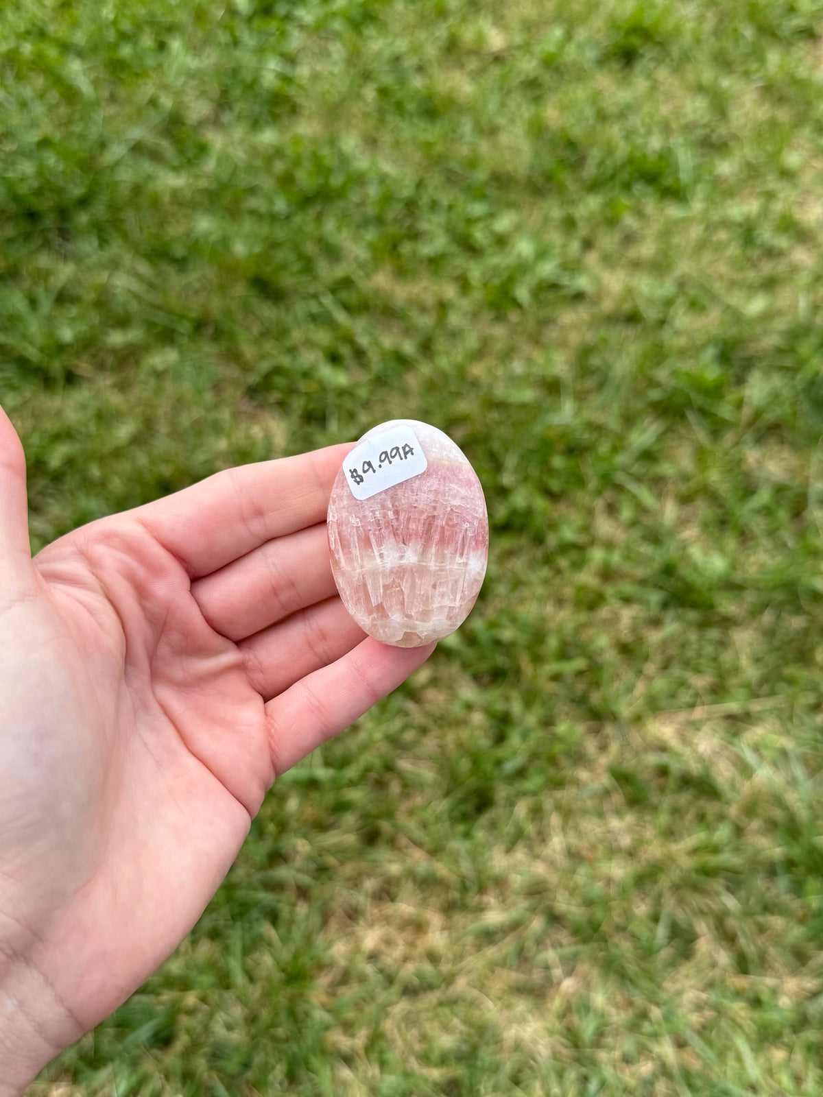 Small rose calcite palm stone