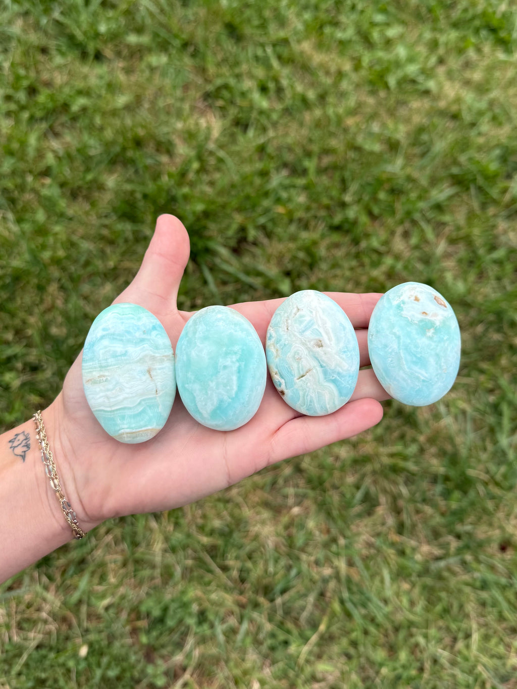 Medium blue aragonite palm stones