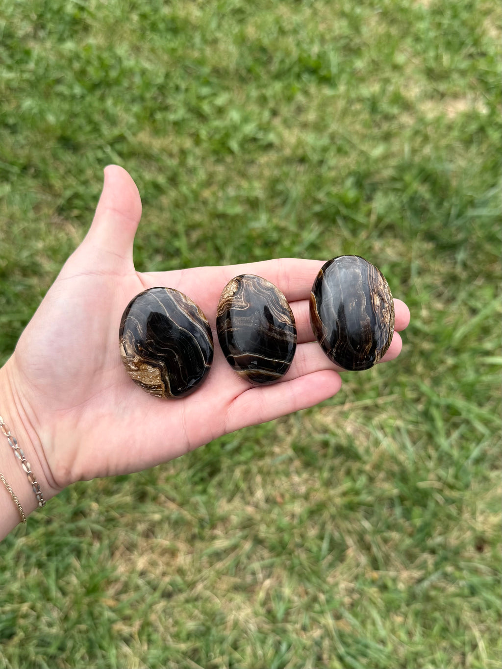 Small chocolate calcite palm stones