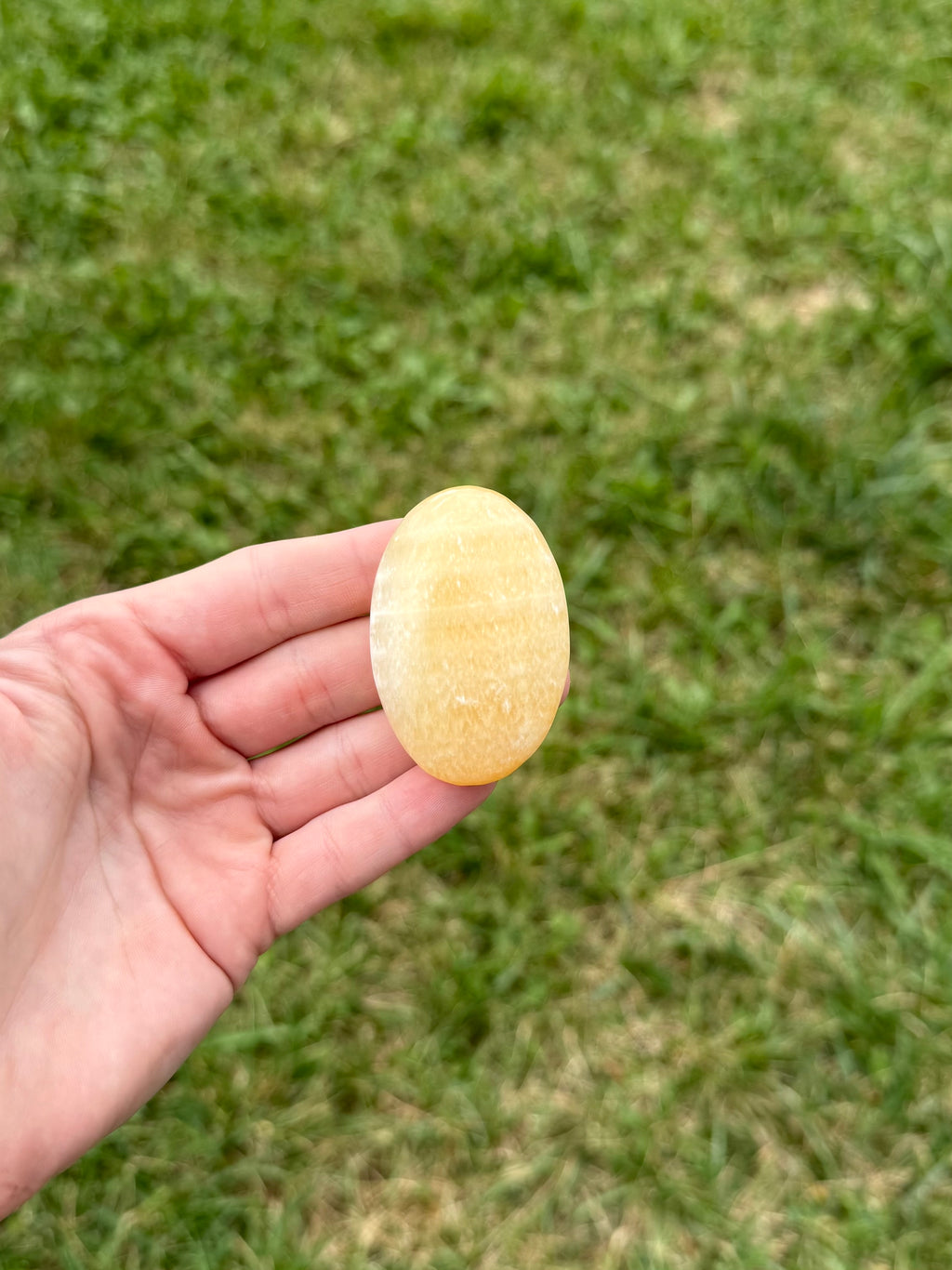 Medium orange calcite palm stones
