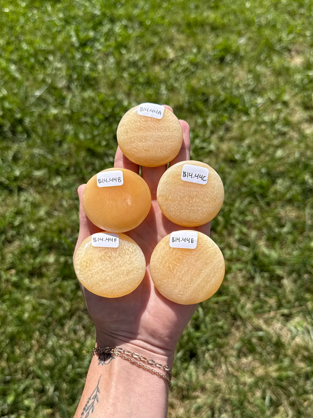 Large orange calcite round flats