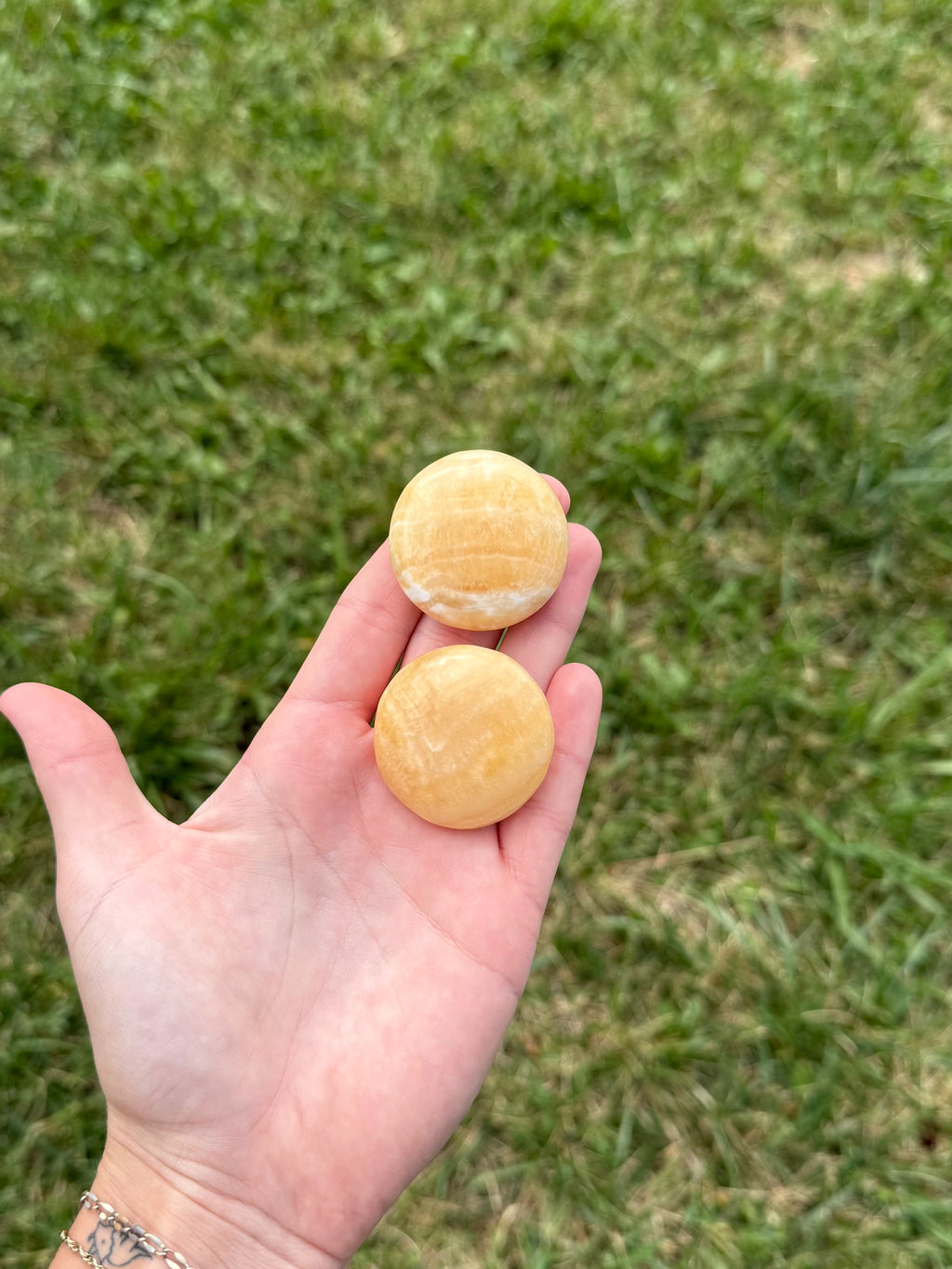 Small orange calcite round flats