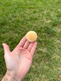Small orange calcite round flats