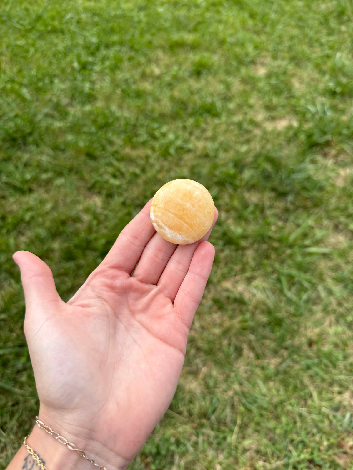 Small orange calcite round flats