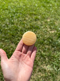Large orange calcite round flats