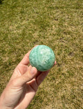 Misfit baja feather fluorite sphere
