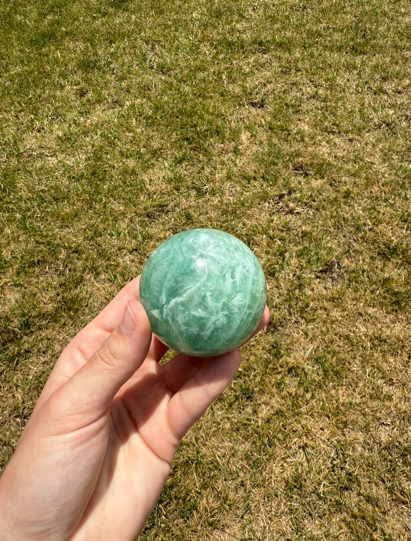 Misfit baja feather fluorite sphere