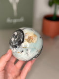 Large Caribbean calcite with hematite sphere