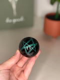 Engraved obsidian sphere