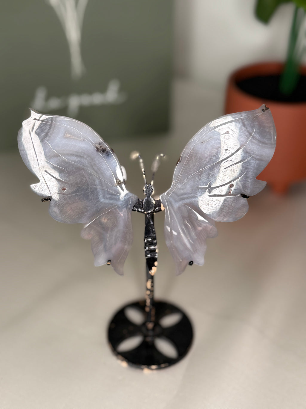 Imperfect agate butterfly wings on a stand