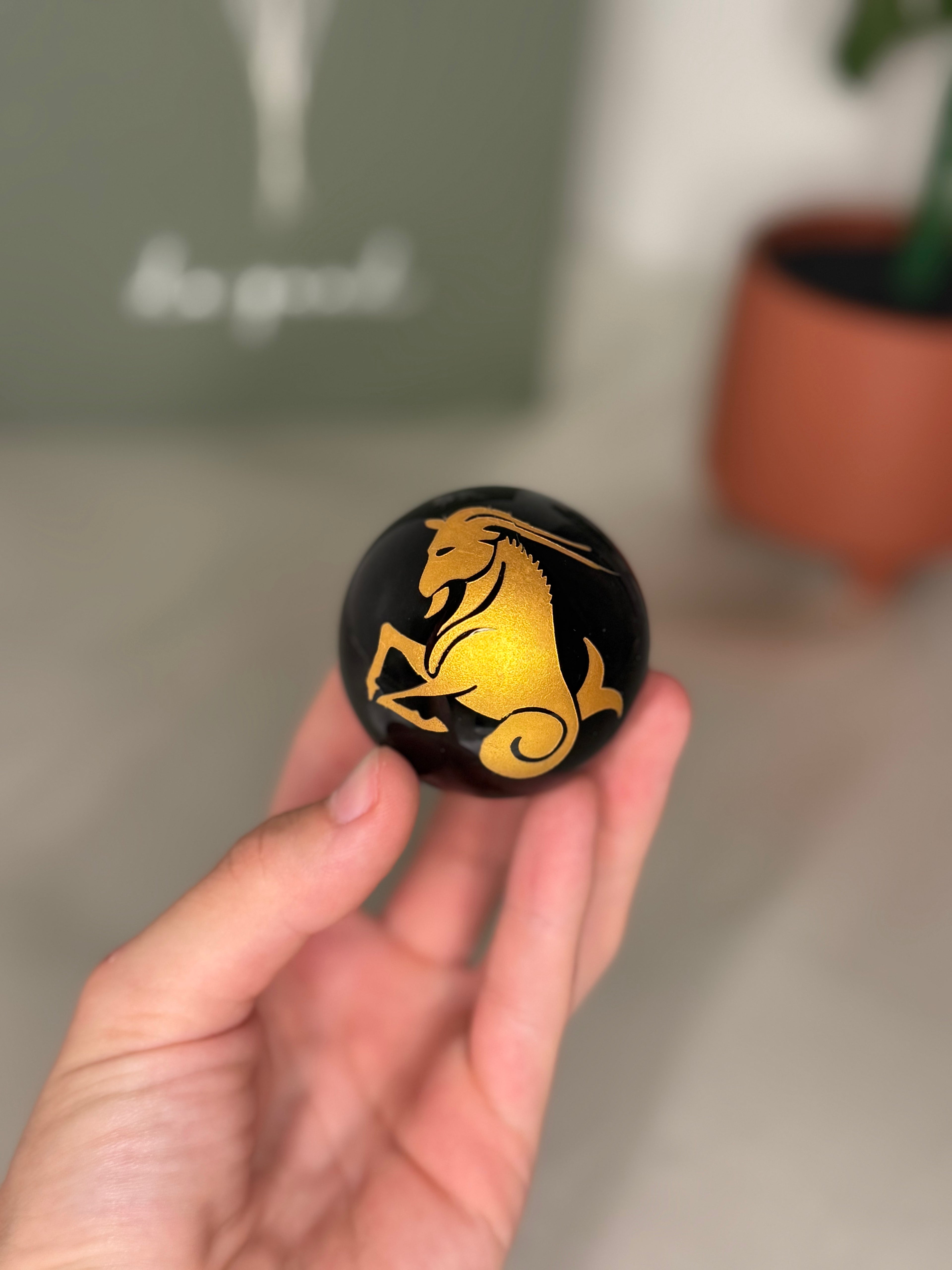 Capricorn zodiac obsidian sphere