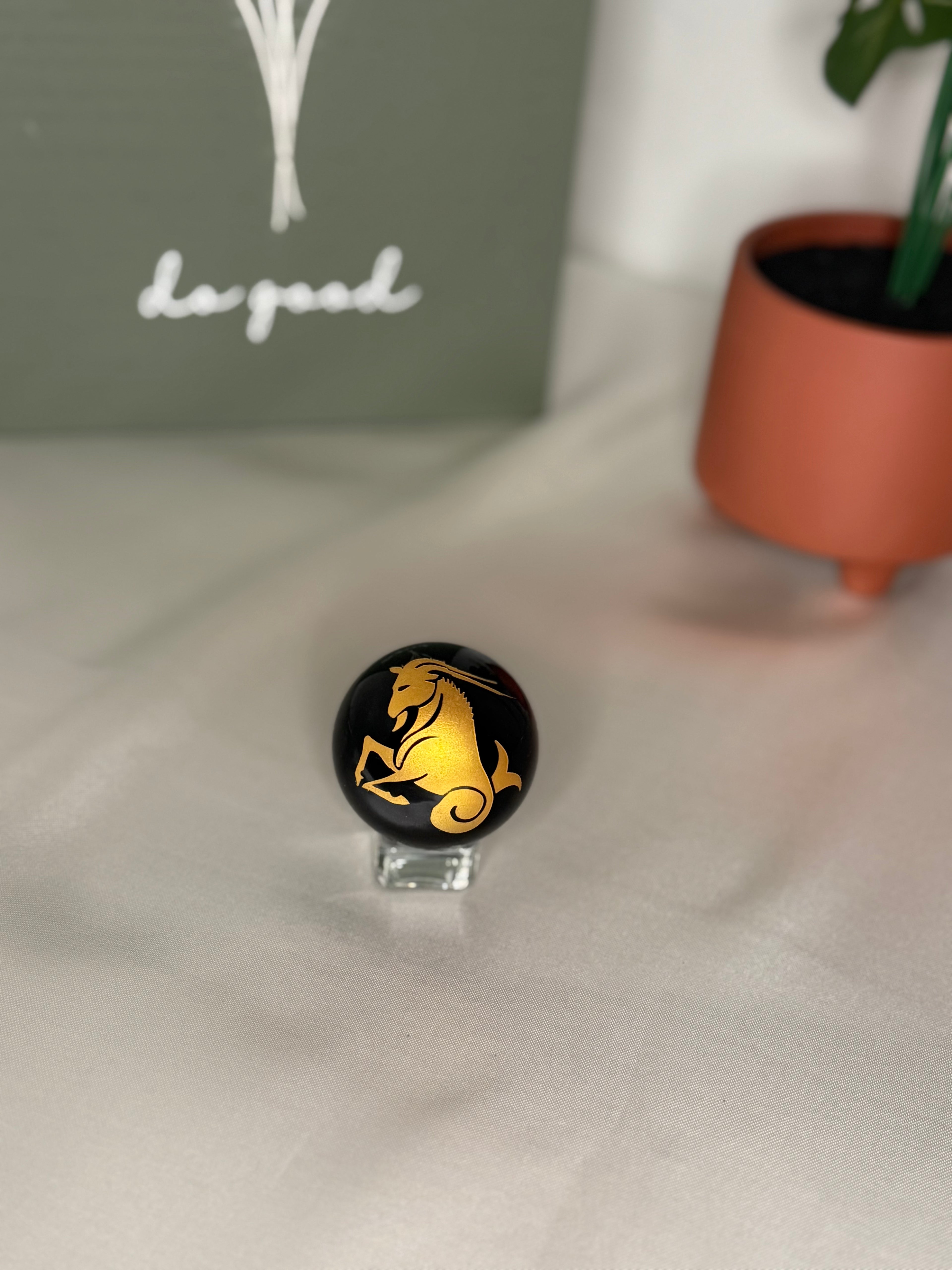 Capricorn zodiac obsidian sphere