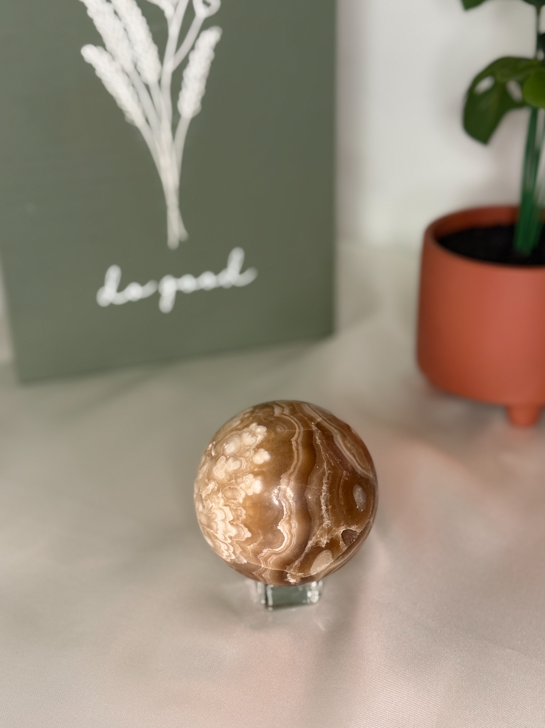 Amber calcite sphere (UV reactive)