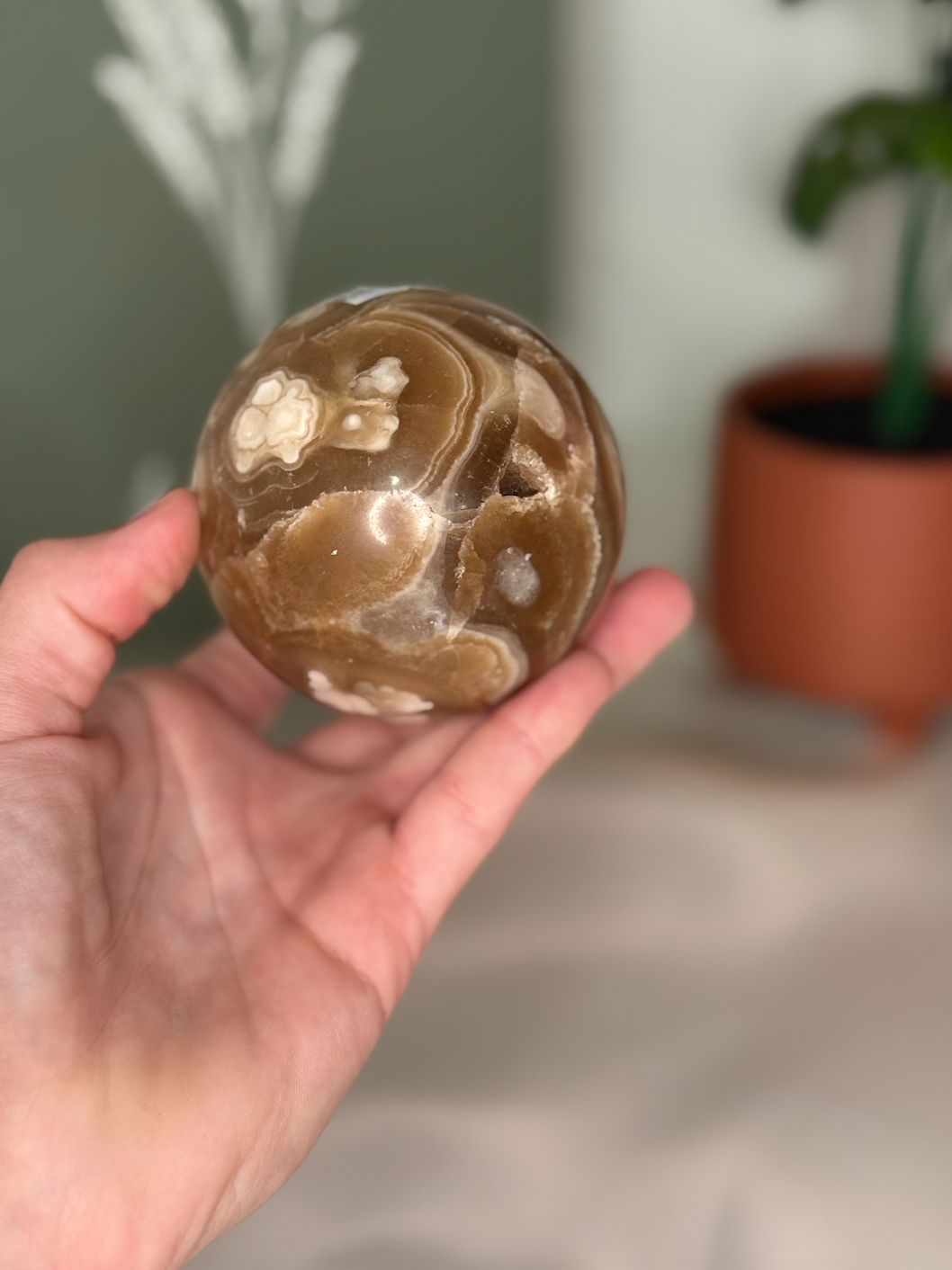 Amber calcite sphere (UV reactive)