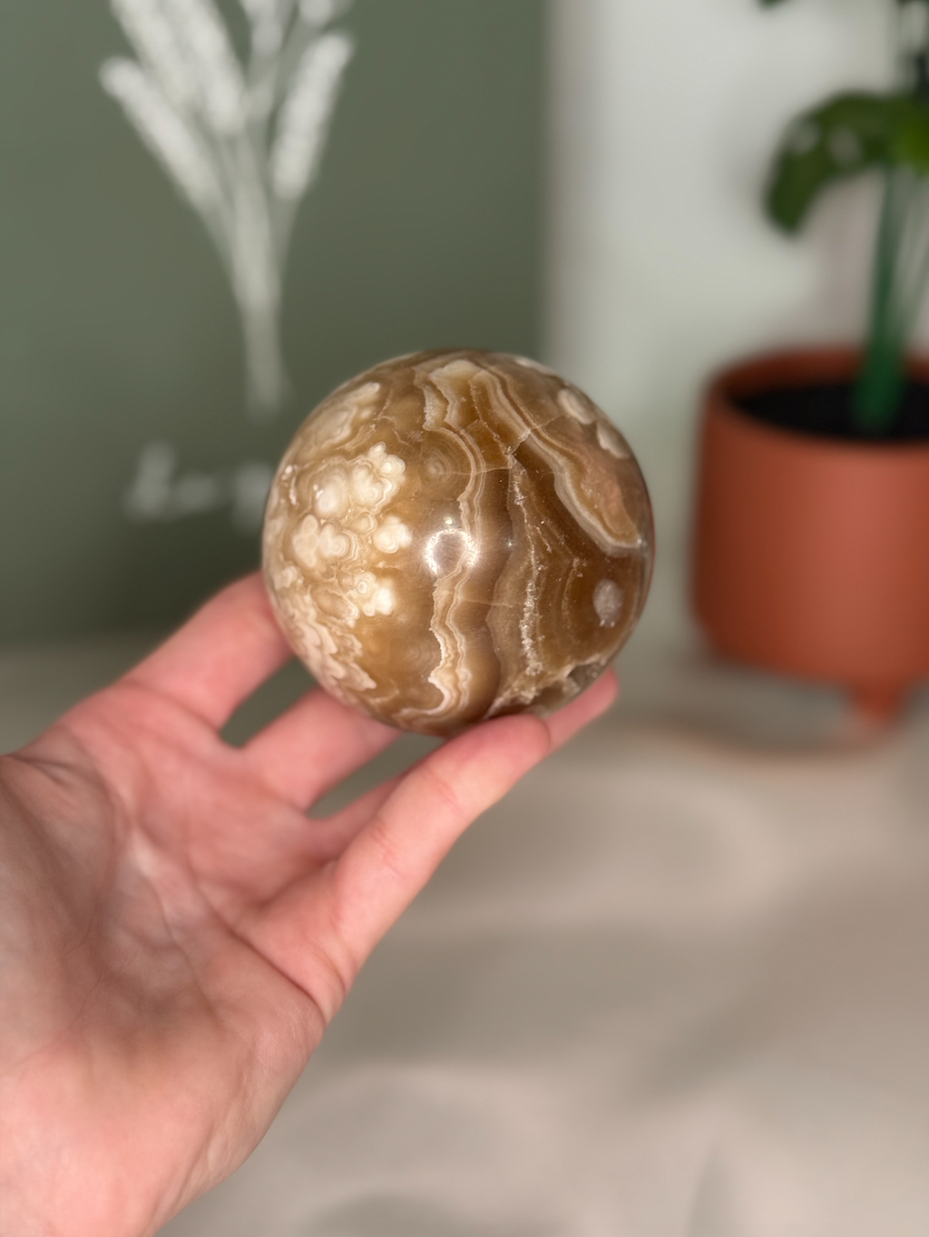 Amber calcite sphere (UV reactive)